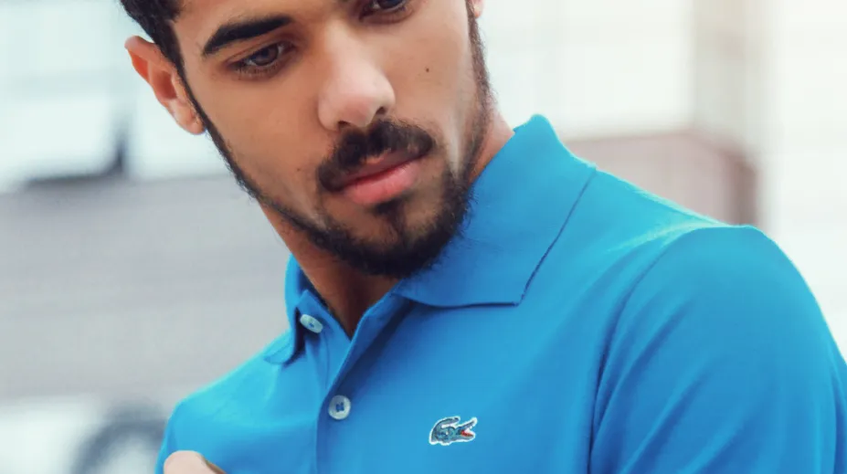 man-wearing-blue-lacoste-polo-shirt-and-silver-colored-1232459.jpg