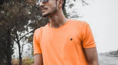 man-standing-while-wearing-orange-crew-neck-shirt-near-tree-1392045.jpg